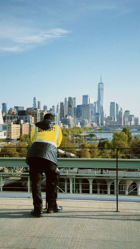 unarmed security guard observing activity at commercial property