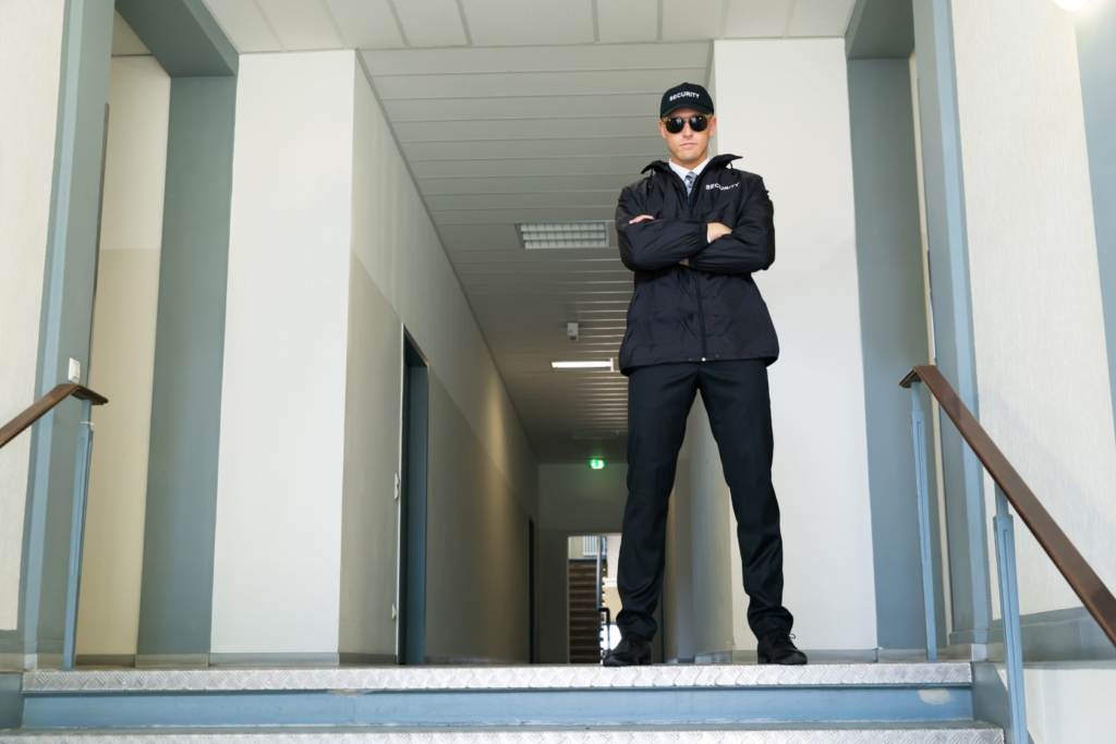 Stationary security guard monitoring a building entrance